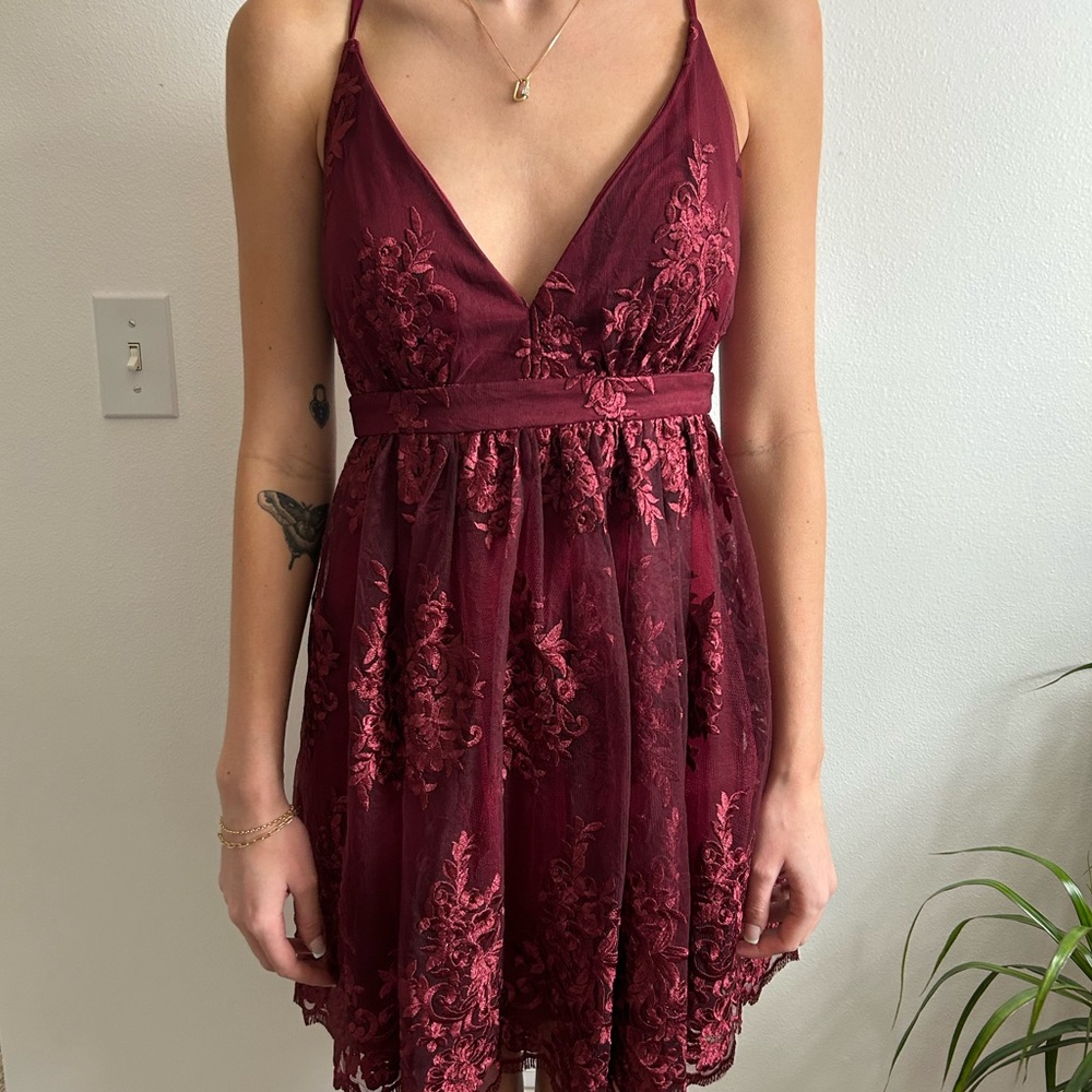 This is a Floral maroon short formal dress